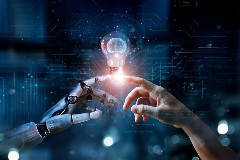 Illustration of a human hand and a robotic hand reaching towards a glowing light